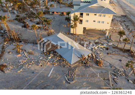 Ruined buildings in need of demolition or repair. Storm surge water and wind damaged houses roof and collapsed walls after hurricane in Florida Ruined buildings in need of demolition or repair. Storm surge water and wind damaged houses roof and collapsed walls after hurricane in Florida 126361248