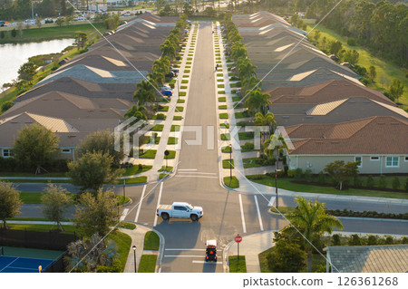 Rich neighborhood with expensive residential homes in southwest Florida. Wealthy suburban area 126361268