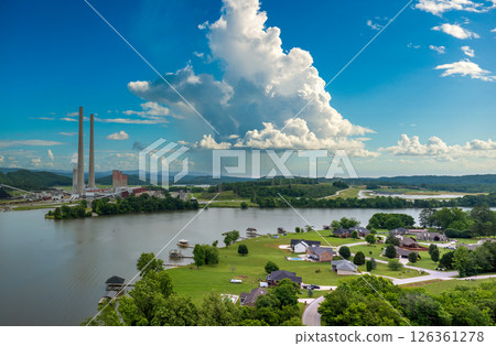 Residential neighborhood close to thermal power plant in Roane County near Kingston, Tennessee. Coal fossil fuel causing environmental pollution during electric energy production in American grid 126361278