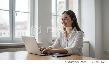 Young woman working on laptop at home office Young woman working on laptop at home office 126361673