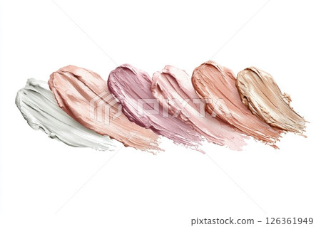 Creamy makeup smears in pastel and neutral tones spread across a white background in textured artistic strokes 126361949