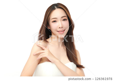 A beautiful young Asian woman with clean, fresh skin against a white background. Skincare, facial treatment, cosmetology, beauty, and spa. An elegant portrait of an Asian woman. 126361978