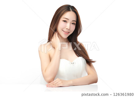 A beautiful young Asian woman with clean, fresh skin against a white background. Skincare, facial treatment, cosmetology, beauty, and spa. An elegant portrait of an Asian woman. A beautiful young Asian woman with clean, fresh skin against a white background. Skincare, facial treatment, cosmetology, beauty, and spa. An elegant portrait of an Asian woman. 126361980