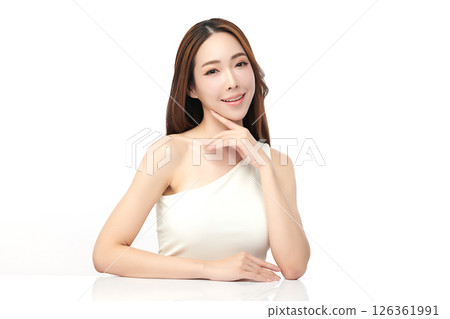 A beautiful young Asian woman with clean, fresh skin against a white background. Skincare, facial treatment, cosmetology, beauty, and spa. An elegant portrait of an Asian woman. 126361991