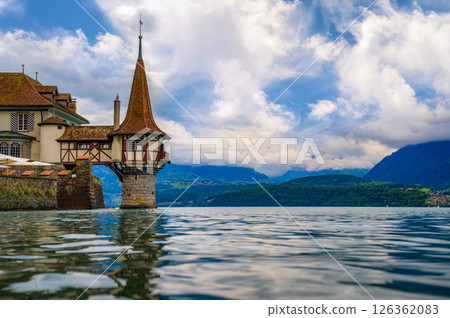 Tower of Oberhofen Castle on Lake Thun with Swiss Alps View in Switzerland 126362083