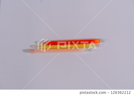 colorful pencils on white paper 126362212