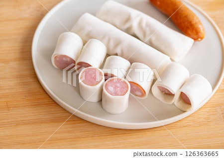 Sausage wrapped in spring roll skin 126363665