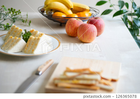 Bright kitchen with apples and sandwiches 126365078