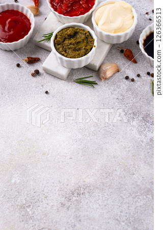 Set of different sauces. Ketchup, mustard, pesto 126366513