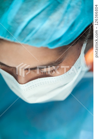 Female doctor performing a surgery. Surgery and insurance concept. 126366804