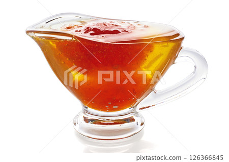 fruit sweet jam in glass sauceboat isolated on white background. fruit sweet jam in glass sauceboat isolated on white background. 126366845