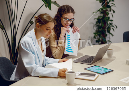 Engaging Collaborative Business Meeting in a Modern Office Setting with a Dynamic Atmosphere Engaging Collaborative Business Meeting in a Modern Office Setting with a Dynamic Atmosphere 126367065