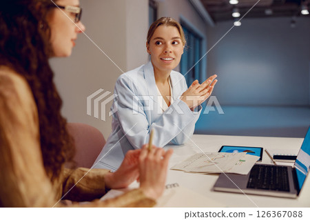 Two Businesswomen Engaged in a Collaborative Meeting to Achieve Their Business Goals Effectively 126367088