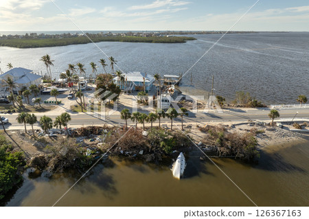 Natural disaster consequences. Destroyed sailboats after hurricane in Florida 126367163