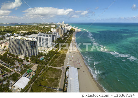 Miami Beach is popular vacation spot in southern Florida. Sandy beach surface and tourist infrastructure 126367184