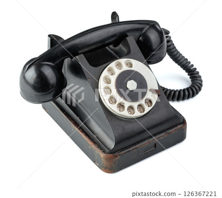 Vintage black phone isolated on a white background. Vintage black phone isolated on a white background. 126367221