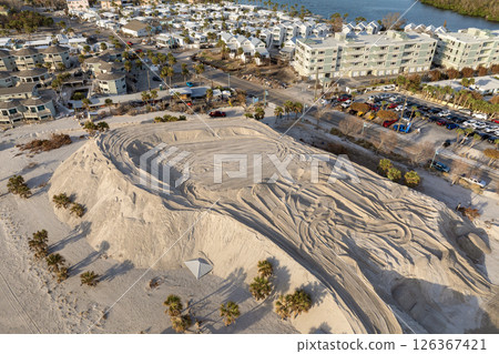 Hurricane Milton aftermath cleanup. Sand piles at Englewood Beach on Manasota Key. Sand recipient site after storm surge Hurricane Milton aftermath cleanup. Sand piles at Englewood Beach on Manasota Key. Sand recipient site after storm surge 126367421