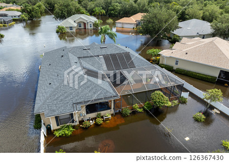 Hurricane Debby tropical rainstorm flooded residential homes in suburban community in Sarasota, Florida. Aftermath of natural disaster 126367430