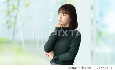 A young woman/businesswoman thinking A young woman/businesswoman thinking 126367505