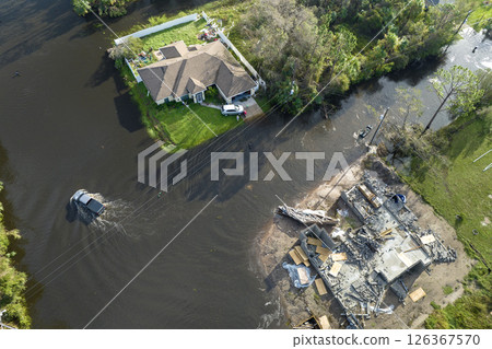 Flooded houses by hurricane rainfall in Florida residential area. Consequences of natural disaster 126367570