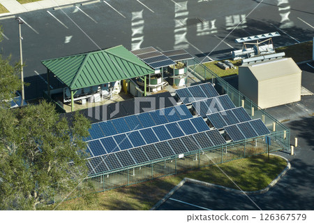 Fenced backyard facility with solar photovoltaic panels for producing of clean ecological electrical energy. Concept of autonomous housing 126367579