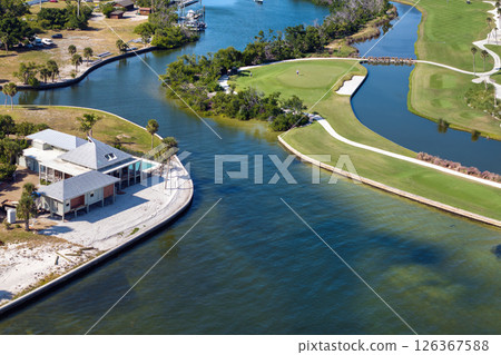 Expensive residential houses in island small town Boca Grande on Gasparilla Island in southwest Florida. American dream homes as example of real estate development in US suburbs 126367588