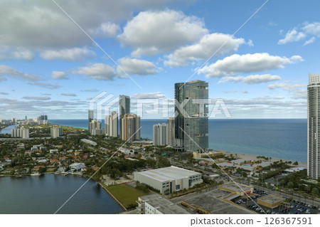 Expensive highrise hotels and condos on Atlantic ocean shore in Sunny Isles Beach city. American tourism infrastructure in southern Florida 126367591