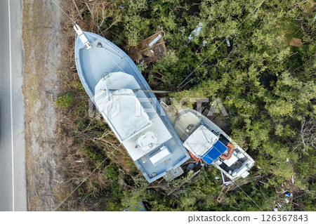 Destroyed sailing yacht capsized on shallow bay waters after hurricane Milton on Manasota Key in Englewood, Florida Destroyed sailing yacht capsized on shallow bay waters after hurricane Milton on Manasota Key in Englewood, Florida 126367843