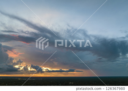 Colofrul clouds brightly illuninated by setting sun on evening sky. Changing cloudscape weather at sunset Colofrul clouds brightly illuninated by setting sun on evening sky. Changing cloudscape weather at sunset 126367980