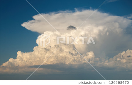 Bright landscape of blue sky with flying white clouds. Colorful summer skyscape Bright landscape of blue sky with flying white clouds. Colorful summer skyscape 126368470