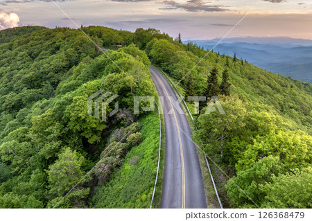 Blue Ridge Parkway road in summer woods of Appalachian mountains with green canopies in colorful forest. Road trip driving in wild nature in summertime season 126368479