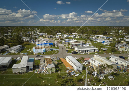 Badly damaged mobile homes after hurricane Ian in Florida residential area. Consequences of natural disaster Badly damaged mobile homes after hurricane Ian in Florida residential area. Consequences of natural disaster 126368498