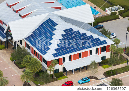 Autonomous building in Florida with photovoltaic rooftop covered with solar panels for producing of clean ecological electrical energy in town center 126368507