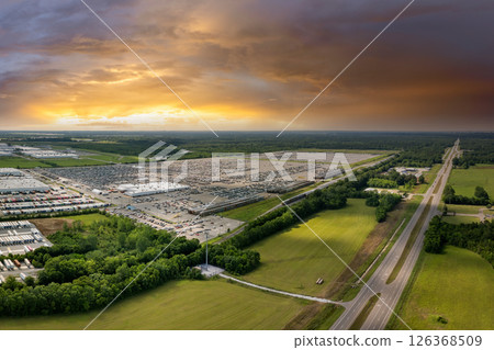 Automotive industry. Import or export of new cars at production factory warehouse. Vehicles for sale at logistics business parking lot 126368509
