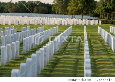 Army veteran cemetery with white headstones. Tombs of retired military soldiers. Memorial Day concept 126368512