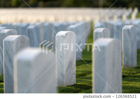 American national military cemetery with rows of white tomb stones on green grass lawn. Memorial Day concept 126368521