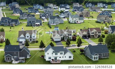 American dream homes as example of real estate development in US suburbs. View from above of residential houses in living area in Rochester, NY American dream homes as example of real estate development in US suburbs. View from above of residential houses in living area in Rochester, NY 126368528