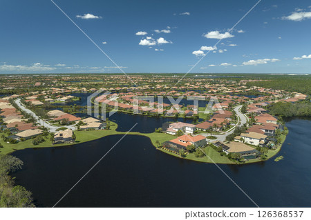 Aftermath of natural disaster. Surrounded by hurricane Ian rainfall flood waters homes in Florida residential area 126368537