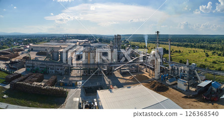 Aerial view of wood processing factory with stacks of lumber at plant manufacturing yard. 126368540