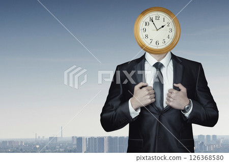 Businessman with clock for a head in city skyline 126368580