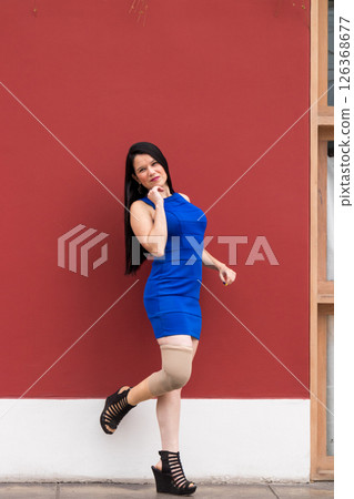 Woman with prosthetic leg is happy about her condition 126368677