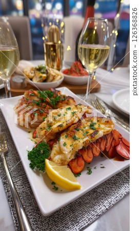 Gourmet lobster tail dinner with garlic herb butter and fine dining ambience. 126368826