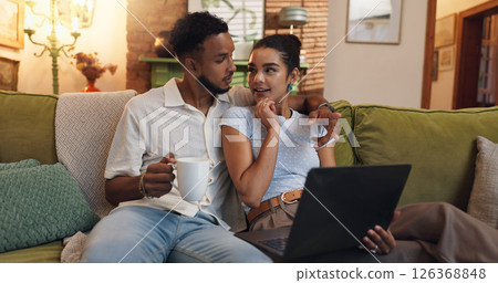Couple, relax and coffee with laptop on sofa for research, browsing or online entertainment at home. Man, woman or lovers with cup or computer on couch for network, connection or discussion at house Couple, relax and coffee with laptop on sofa for research, browsing or online entertainment at home. Man, woman or lovers with cup or computer on couch for network, connection or discussion at house 126368848
