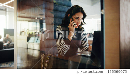 Feedback, laptop and phone call with business woman in office pod for communication or update. Computer, conversation and planning with mature employee in cubicle for accounting or hybrid work Feedback, laptop and phone call with business woman in office pod for communication or update. Computer, conversation and planning with mature employee in cubicle for accounting or hybrid work 126369073