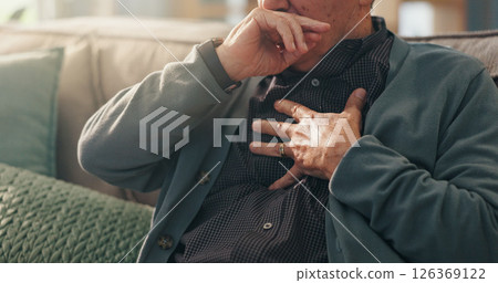Home, hands and old man with chest pain, cough and cardiac symptoms in lounge. Closeup, hypertension or elderly person with heart attack signs, retirement and viral infection with illness or asthma 126369122