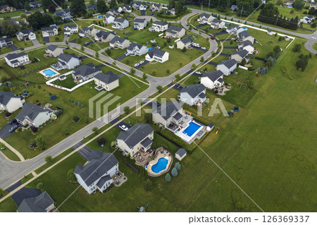 Aerial view of spacious new family houses in upstate New York suburban area. Real estate development in american suburbs Aerial view of spacious new family houses in upstate New York suburban area. Real estate development in american suburbs 126369337