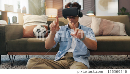 Simulation, gamer and man with vr headset, home and 3D virtual reality with tech for games and online. House, player and person with eyewear for entertainment, user experience and fantasy in lounge Simulation, gamer and man with vr headset, home and 3D virtual reality with tech for games and online. House, player and person with eyewear for entertainment, user experience and fantasy in lounge 126369346