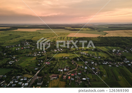 Aerial view of residential houses in suburban rural area at sunset 126369390