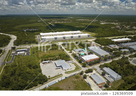 Aerial view of industrial park with goods warehouses and logistics centers in city zone from above 126369509