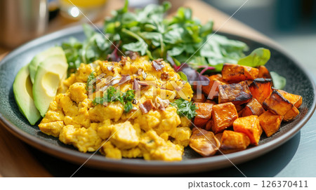 Healthy Breakfast Plate with Scrambled Eggs, Avocado, and Roasted Vegetables 126370411